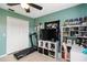 Bedroom with a desk, TV, and a treadmill at 4649 72Nd E Ct, Bradenton, FL 34203
