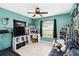 Bedroom with a desk, TV, and a treadmill at 4649 72Nd E Ct, Bradenton, FL 34203