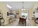 Bright dining area connects to kitchen and features sliding doors to outdoor patio at 4649 72Nd E Ct, Bradenton, FL 34203