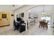 Open dining area leads to a modern kitchen and offers views of the adjacent office space at 4649 72Nd E Ct, Bradenton, FL 34203