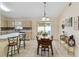 Dining room with wood table, chairs, tile flooring, and sliding glass doors to backyard at 4649 72Nd E Ct, Bradenton, FL 34203