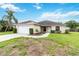 Charming single-story home with a well-manicured lawn and attached two-car garage at 4649 72Nd E Ct, Bradenton, FL 34203