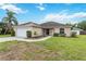 Well-maintained single-story home with a two-car garage and lush green lawn at 4649 72Nd E Ct, Bradenton, FL 34203