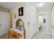 Hallway featuring a vanity and mirror, closet, and access to a bathroom space at 4649 72Nd E Ct, Bradenton, FL 34203