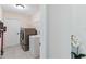 This laundry room offers tile floors, a washing machine, a dryer, and a utility sink at 4649 72Nd E Ct, Bradenton, FL 34203