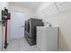 Well-lit laundry room featuring a modern washer and dryer set and ample storage space at 4649 72Nd E Ct, Bradenton, FL 34203