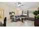 Cozy living room features neutral paint, tile flooring, and a comfortable sectional sofa at 4649 72Nd E Ct, Bradenton, FL 34203