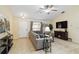 Comfortable living room with a vaulted ceiling, tile flooring, and entertainment center at 4649 72Nd E Ct, Bradenton, FL 34203