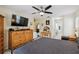 Spacious primary bedroom featuring a ceiling fan, furniture, and multiple doorways at 4649 72Nd E Ct, Bradenton, FL 34203