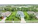 Aerial view of a home with a manicured lawn, and view of a tranquil lake and residential community at 4654 Claremont Park Dr, Bradenton, FL 34211