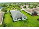 Scenic aerial view showcasing the home's backyard, landscaping, and the surrounding residential neighborhood at 4654 Claremont Park Dr, Bradenton, FL 34211