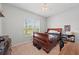 Cozy bedroom with a ceiling fan, large window, and a comfortable bed at 4654 Claremont Park Dr, Bradenton, FL 34211