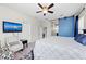 A bedroom features a barn door, tv and chair at 4654 Claremont Park Dr, Bradenton, FL 34211