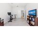 Bonus room features exercise equipment, a ceiling fan, and vinyl floors at 4654 Claremont Park Dr, Bradenton, FL 34211