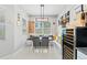 Cozy breakfast nook with a built-in bench, wine fridge, and natural light at 4654 Claremont Park Dr, Bradenton, FL 34211