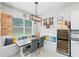 Charming breakfast nook with bench seating, a modern light fixture, and wine storage at 4654 Claremont Park Dr, Bradenton, FL 34211