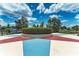 Charming circular garden with colorful landscaping, park benches, and a peaceful community gathering spot at 4654 Claremont Park Dr, Bradenton, FL 34211