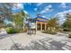 Attractive community pavilion with map kiosk, seating, and well-maintained landscaping under a sunny sky at 4654 Claremont Park Dr, Bradenton, FL 34211