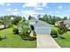 Charming single-story home featuring lush landscaping, a two-car garage, and a well-manicured lawn at 4654 Claremont Park Dr, Bradenton, FL 34211