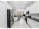 Bright kitchen with stainless steel appliances, white cabinets, and a spacious layout at 4654 Claremont Park Dr, Bradenton, FL 34211