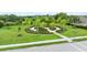 Professionally landscaped island featuring manicured shrubbery and colorful flowers at 4654 Claremont Park Dr, Bradenton, FL 34211