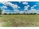 Expansive green field under a sunny sky, perfect for recreational activities and community events at 4654 Claremont Park Dr, Bradenton, FL 34211