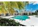 Community pool with a lounging area and a covered structure for shade at 4654 Claremont Park Dr, Bradenton, FL 34211