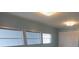 Bedroom featuring three windows, a closet and overhead lighting at 5112 Glen Echo Ave, Sarasota, FL 34234