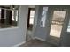 Entranceway with gray wood-look flooring and a decorative window with a view into another living space at 5112 Glen Echo Ave, Sarasota, FL 34234