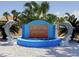 Community entrance sign with dolphin statues and a water feature at 5112 Glen Echo Ave, Sarasota, FL 34234