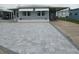 Charming home featuring a newly paved driveway and covered parking area, offering convenience and curb appeal at 5112 Glen Echo Ave, Sarasota, FL 34234