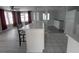 Open-concept living space with hardwood floors, breakfast bar, and ample natural light at 5112 Glen Echo Ave, Sarasota, FL 34234