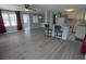 Inviting living room and kitchen combo, featuring stylish floors, breakfast bar and ample light at 5112 Glen Echo Ave, Sarasota, FL 34234