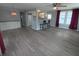 Spacious living room with hardwood floors, a ceiling fan, and great lighting perfect for relaxing and entertaining at 5112 Glen Echo Ave, Sarasota, FL 34234