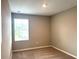 Neutral bedroom featuring carpet flooring and window providing natural light at 5812 Ocean Isle Dr, Nokomis, FL 34275