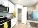 Kitchen with stainless steel appliances, granite countertops, and a view of the pantry at 5812 Ocean Isle Dr, Nokomis, FL 34275