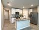 Kitchen with granite countertops, white cabinets, and stainless steel appliances at 5812 Ocean Isle Dr, Nokomis, FL 34275