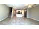 Open-concept living space with stairs, kitchen, and living area all in one photo at 5812 Ocean Isle Dr, Nokomis, FL 34275