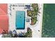 Aerial view of a stunning home with a pool, spa, dock, and lush landscaping at 585 Gunwale Ln, Longboat Key, FL 34228