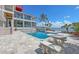 Stunning backyard with a pool, spa, and beautiful waterfront views at 585 Gunwale Ln, Longboat Key, FL 34228