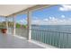 Balcony offering stunning views of the serene ocean and surrounding coastal landscape, perfect for relaxing at 585 Gunwale Ln, Longboat Key, FL 34228
