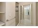 Bathroom featuring tiled floors, a glass shower, and built-in shelving at 585 Gunwale Ln, Longboat Key, FL 34228