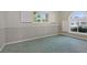 Bedroom featuring carpet flooring and windows at 585 Gunwale Ln, Longboat Key, FL 34228