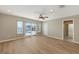 Bedroom showcasing wood floors and sliding glass doors leading to the backyard oasis at 585 Gunwale Ln, Longboat Key, FL 34228