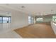Bright bonus room featuring tile and carpet flooring, with access to a screened-in patio and water views at 585 Gunwale Ln, Longboat Key, FL 34228