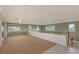 Spacious bonus room with multiple windows offering natural light and views, perfect for flexible living space at 585 Gunwale Ln, Longboat Key, FL 34228