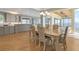 Dining area adjacent to a modern kitchen with views of the ocean, offering seamless living at 585 Gunwale Ln, Longboat Key, FL 34228