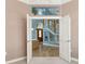 Inviting entryway featuring an open staircase and a decorative stained glass window, creating a warm, welcoming atmosphere at 585 Gunwale Ln, Longboat Key, FL 34228