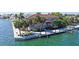 Charming waterfront property boasting a private dock, landscaped grounds, and delightful water views at 585 Gunwale Ln, Longboat Key, FL 34228