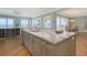 Kitchen with island, marble countertops and ocean views that offer the perfect blend of functionality and luxury at 585 Gunwale Ln, Longboat Key, FL 34228
